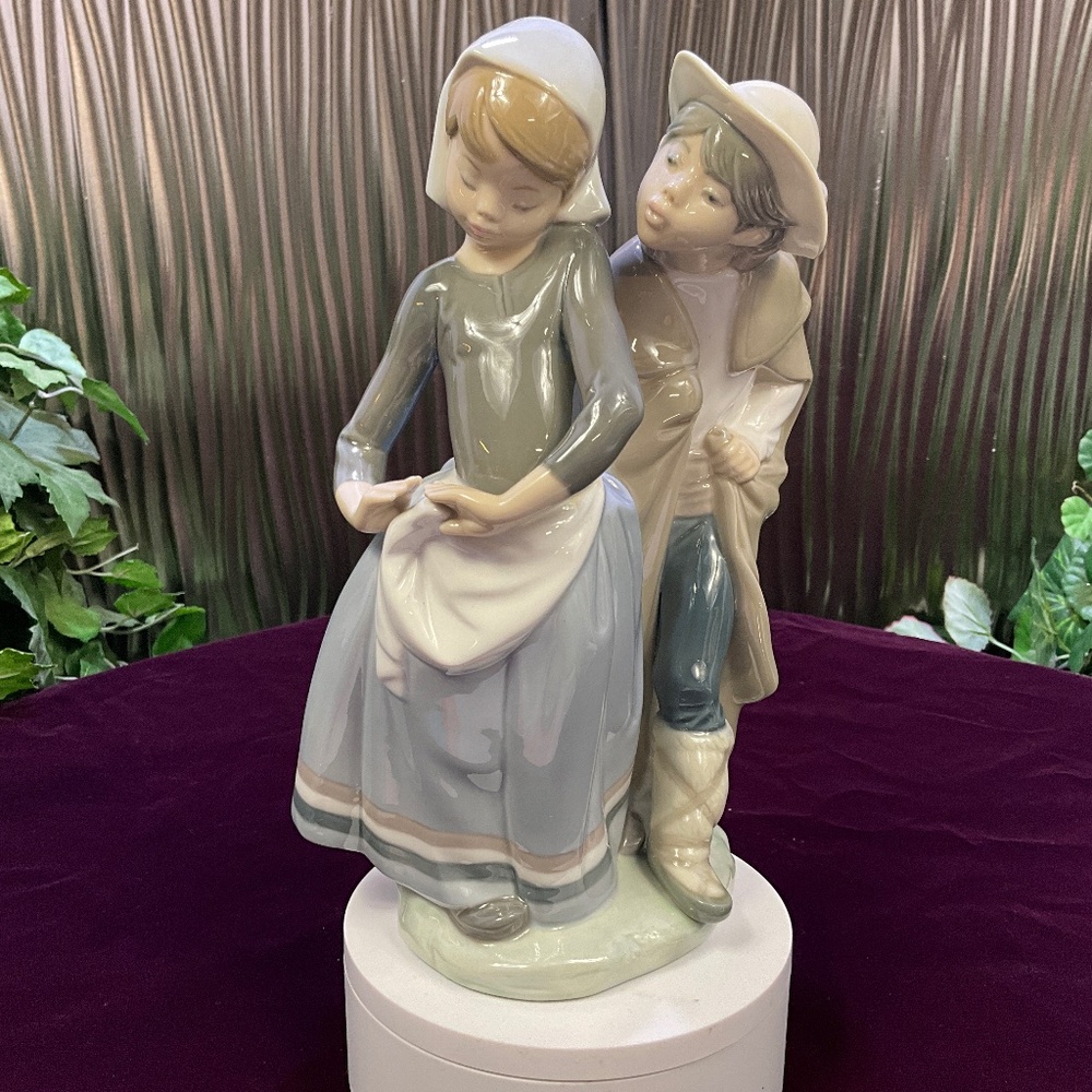 Lladro Figurine Boy Trying to Kiss Girl